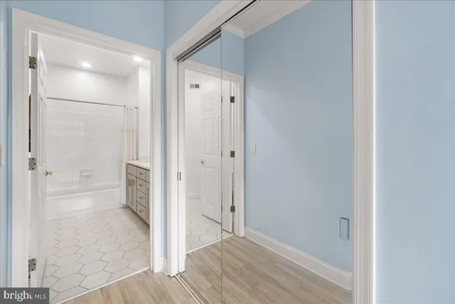 a front view of a house with yard and parking