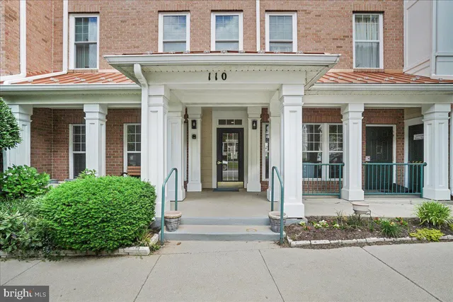 a view of a dining room with furniture wooden floor and chandelier