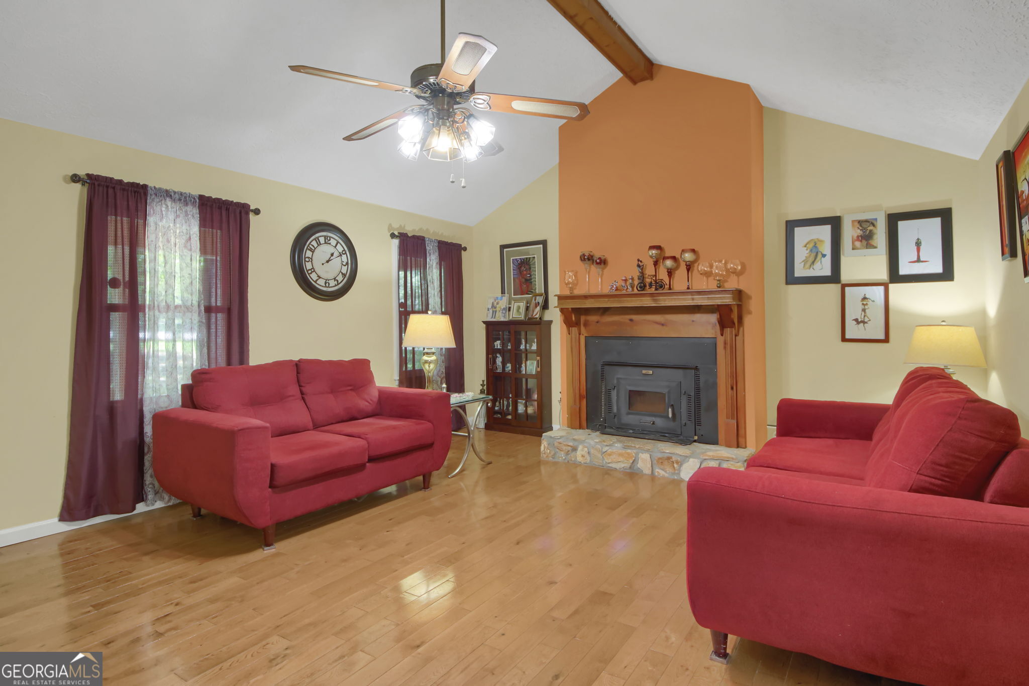 112 Bridget Drive Hampton, GA 30228 - Photo 4 of 26 a living room with furniture and a fireplace