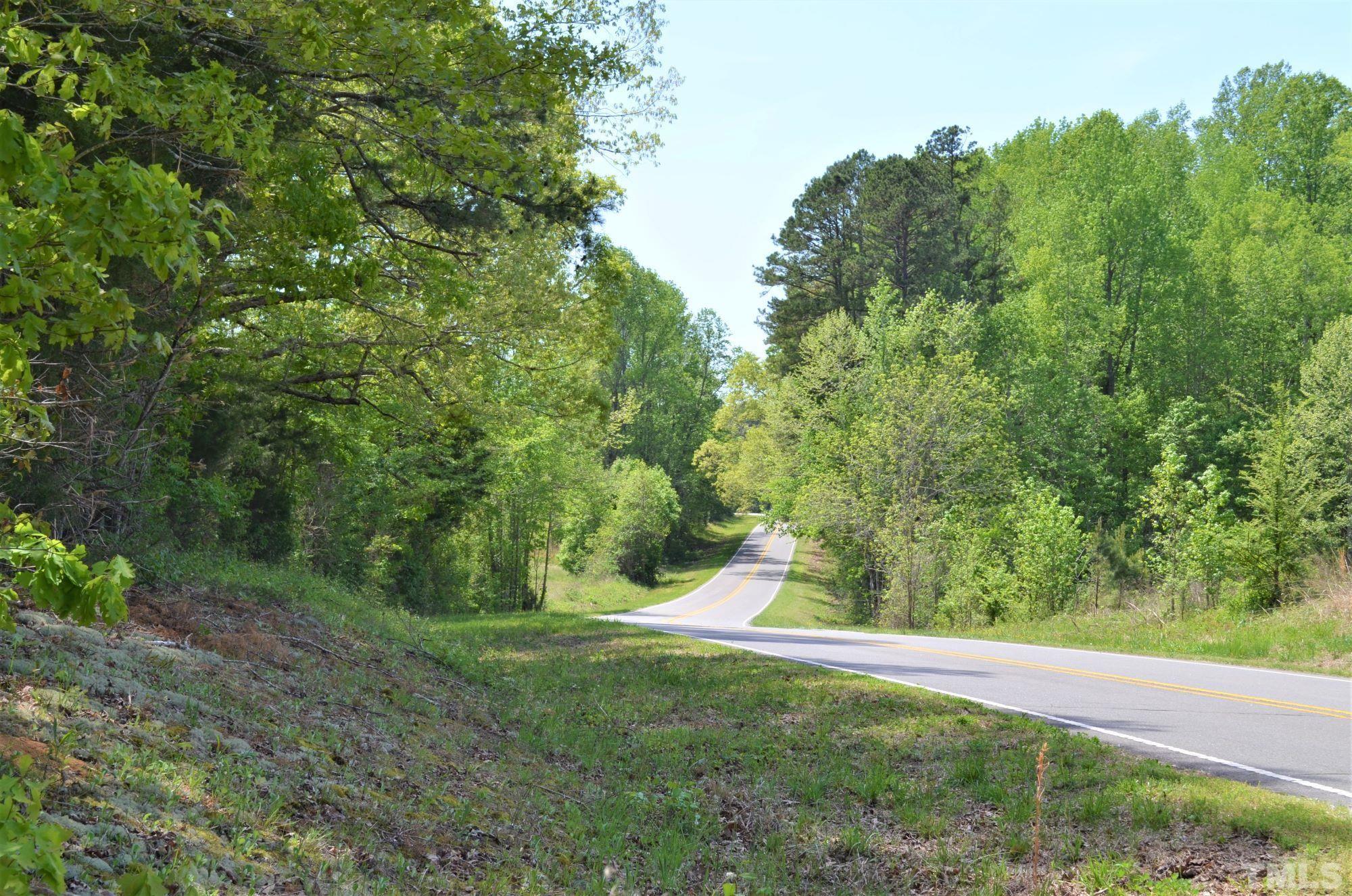 4170 Old Allensville Road Roxboro, NC 27574 - Photo 1 of 11 a view of a tree with a yard