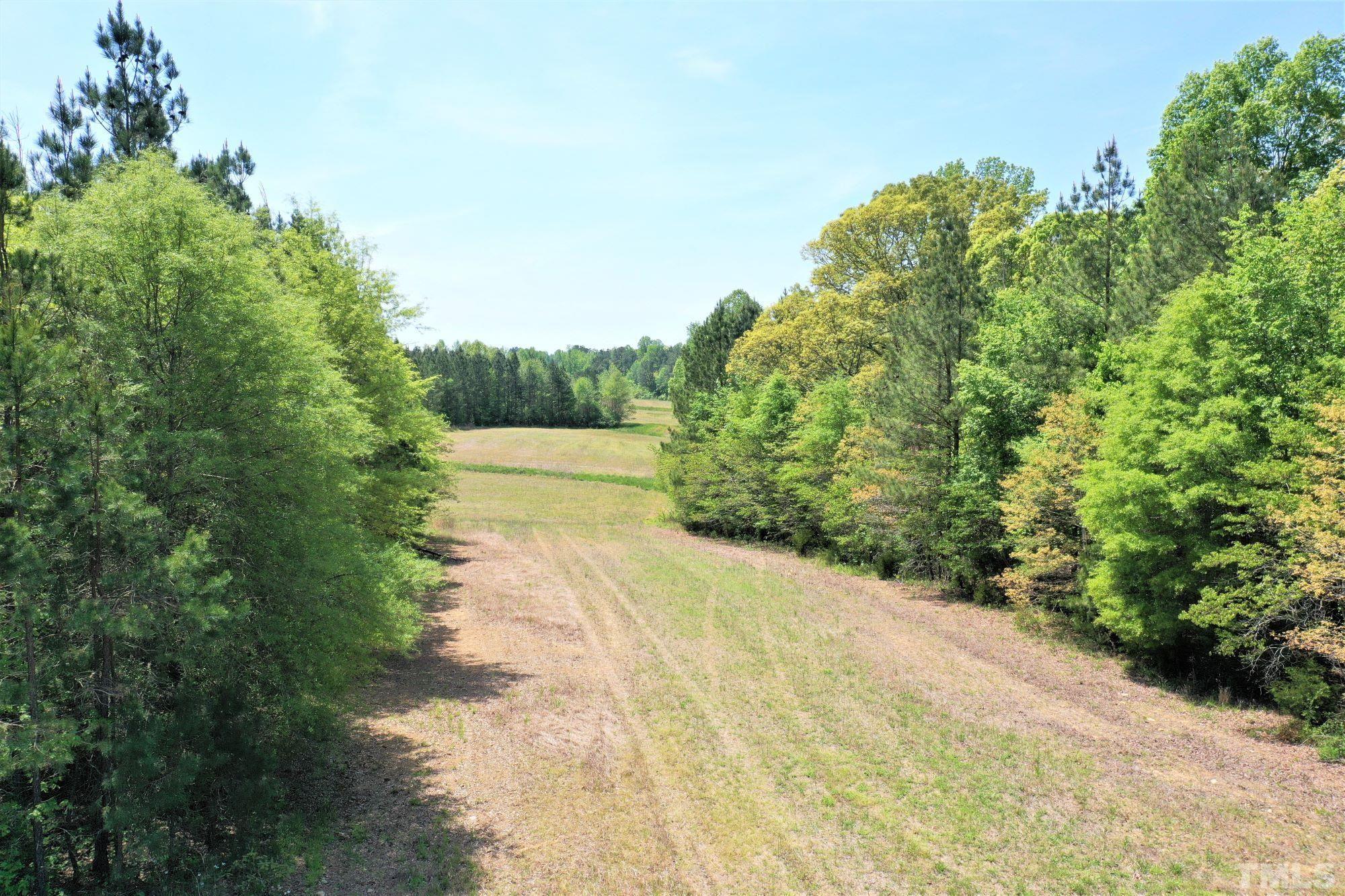 4170 Old Allensville Road Roxboro, NC 27574 - Photo 5 of 11 a view of a road with a yard