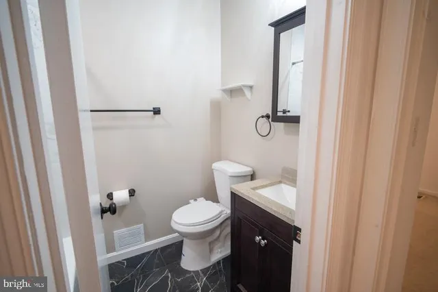 a bathroom with a toilet and a sink