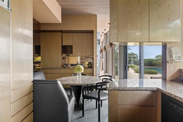 a kitchen with kitchen island granite countertop a sink and counter space