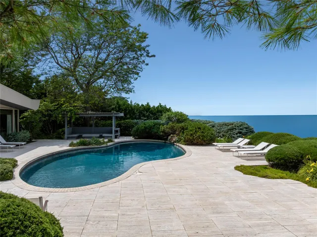 a view of a swimming pool with a lounge chair