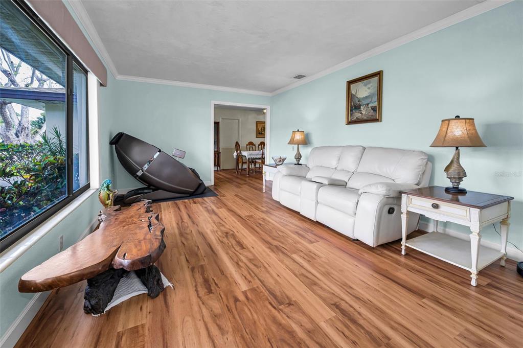 409 Graham Drive Clearwater, FL 33765 - Photo 21 of 75 a living room with furniture and a wooden floor