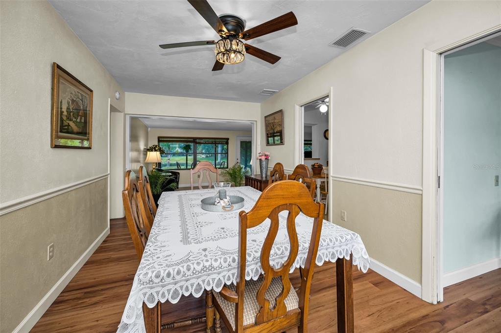 409 Graham Drive Clearwater, FL 33765 - Photo 23 of 75 a view of a dining room with furniture window and wooden floor