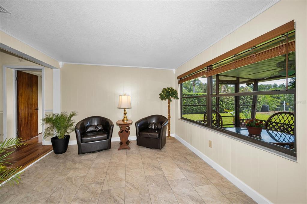 409 Graham Drive Clearwater, FL 33765 - Photo 37 of 75 a living room with furniture and a large window