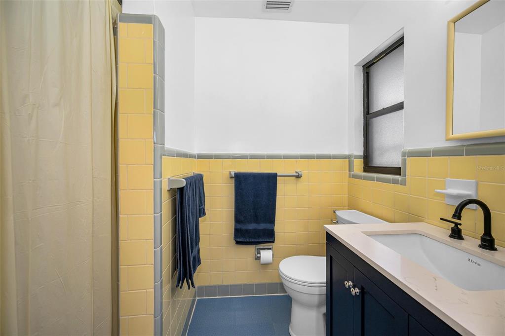 409 Graham Drive Clearwater, FL 33765 - Photo 44 of 75 a bathroom with a sink a toilet and shower
