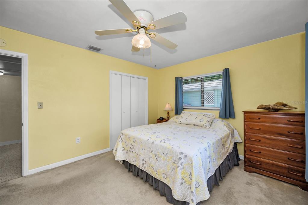 409 Graham Drive Clearwater, FL 33765 - Photo 46 of 75 a bedroom with a bed and a dresser