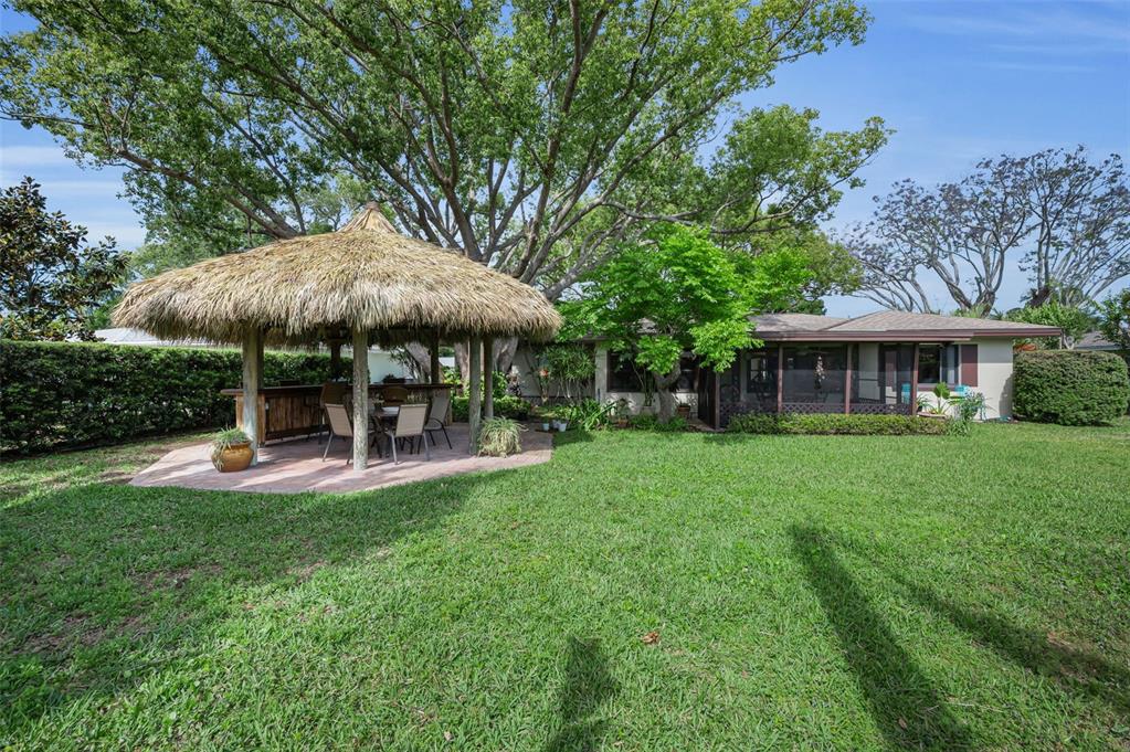 409 Graham Drive Clearwater, FL 33765 - Photo 5 of 75 a view of a house with a yard porch and sitting area