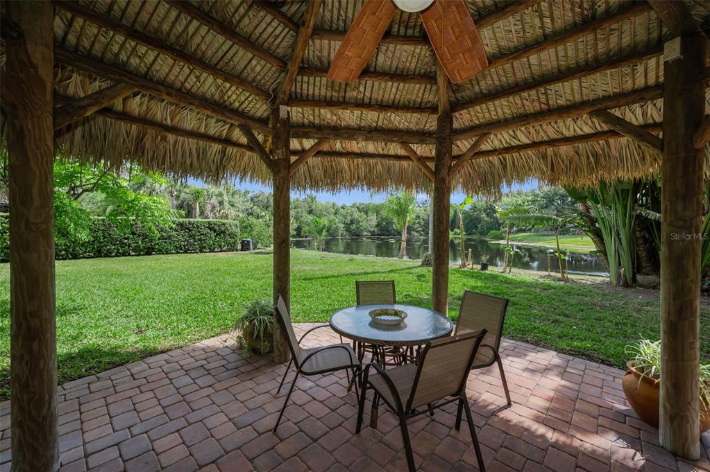 409 Graham Drive Clearwater, FL 33765 - Photo 57 of 75 a view of a patio with a table chairs and a backyard