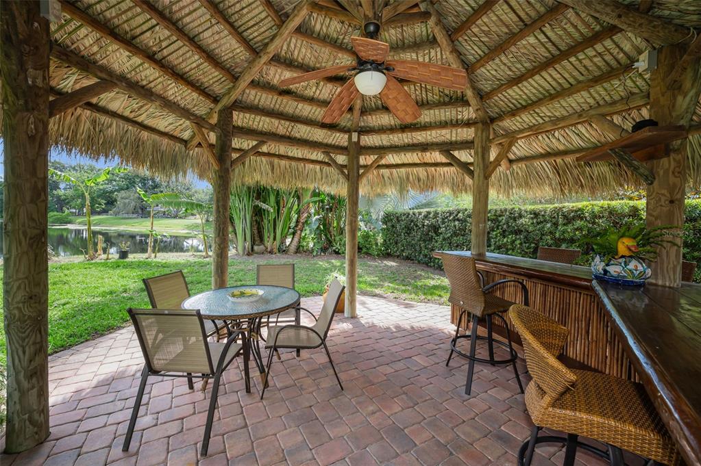 409 Graham Drive Clearwater, FL 33765 - Photo 60 of 75 a view of a patio with a table chairs and a backyard