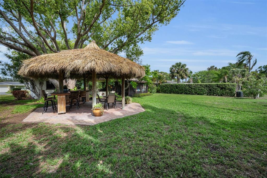409 Graham Drive Clearwater, FL 33765 - Photo 62 of 75 a view of a backyard with sitting area and slide