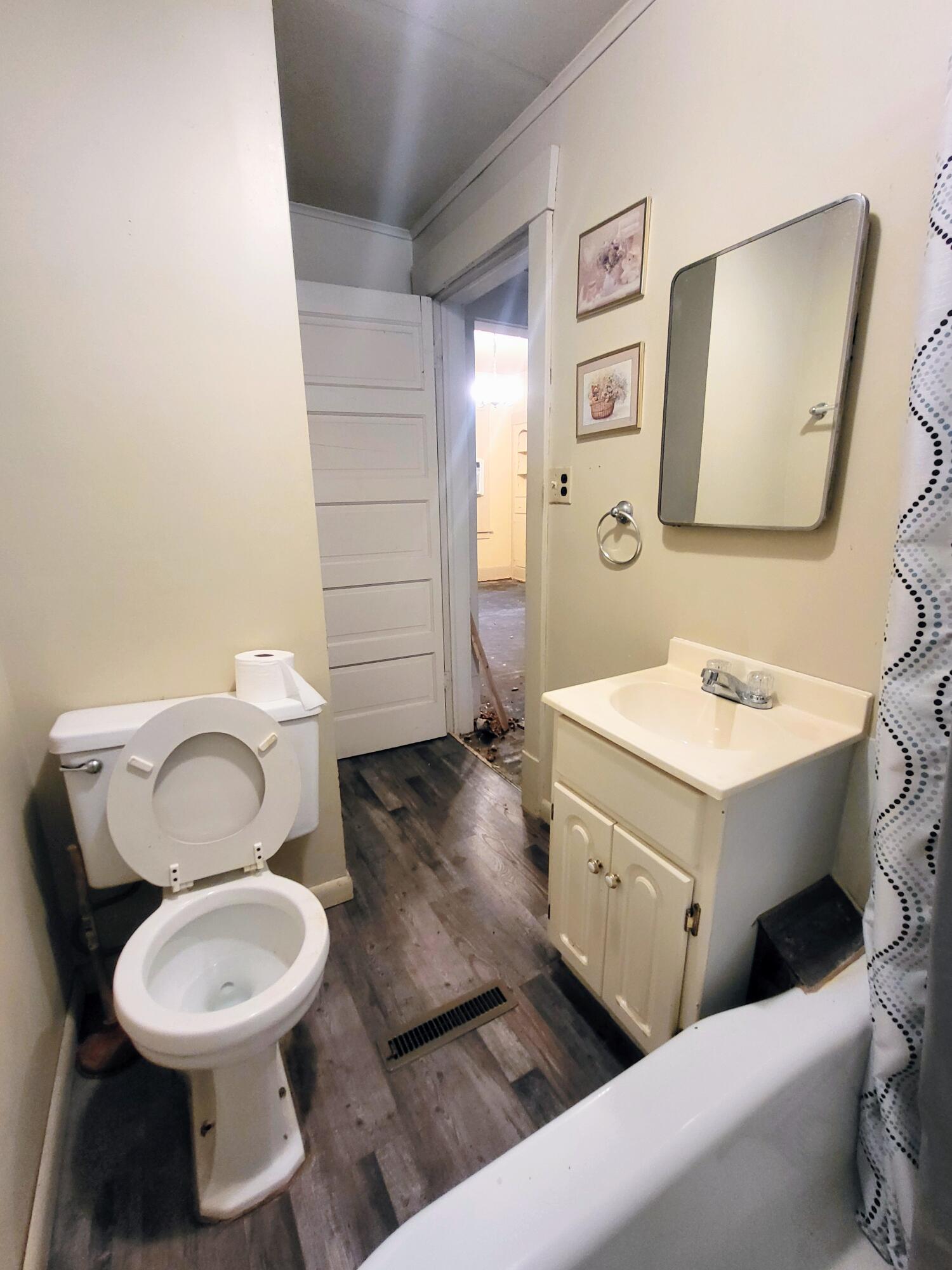 509 North Cullen Street Rensselaer, IN 47978 - Photo 12 of 16 a bathroom with a toilet sink and mirror