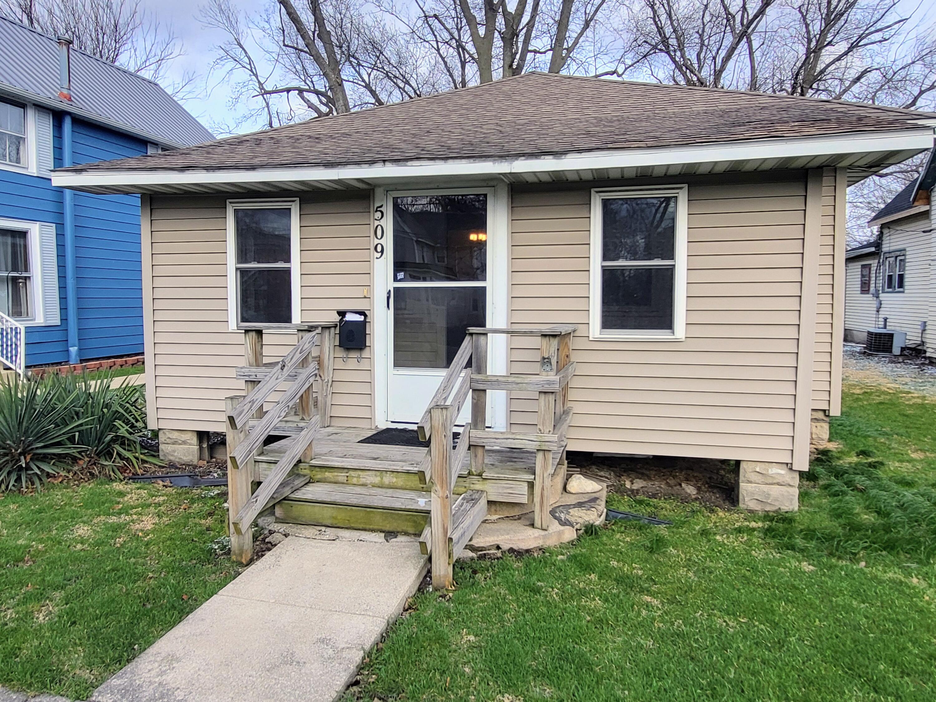 509 North Cullen Street Rensselaer, IN 47978 - Photo 2 of 16 a view of a house with backyard and chairs