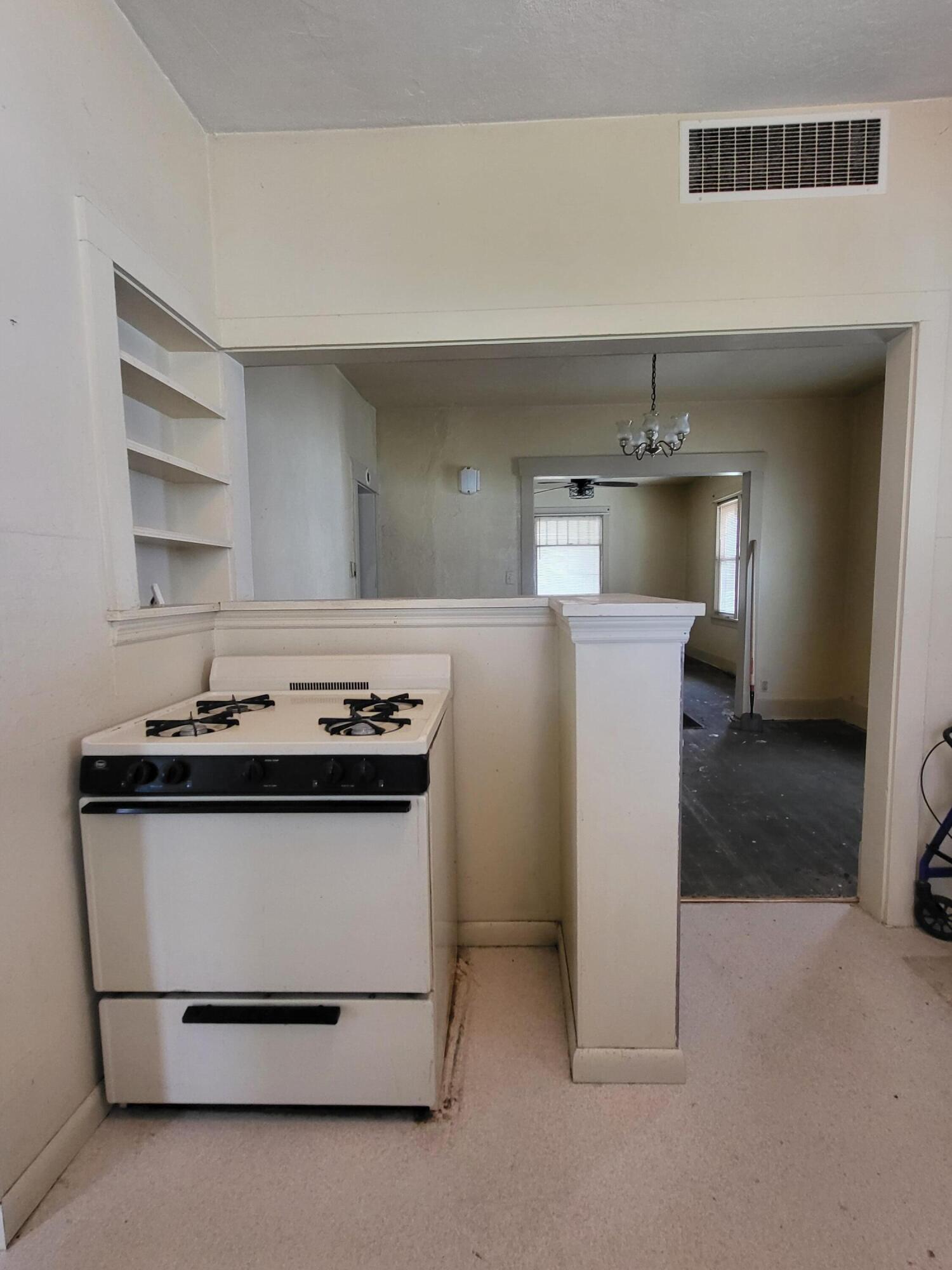 509 North Cullen Street Rensselaer, IN 47978 - Photo 6 of 16 a kitchen with a stove and a sink