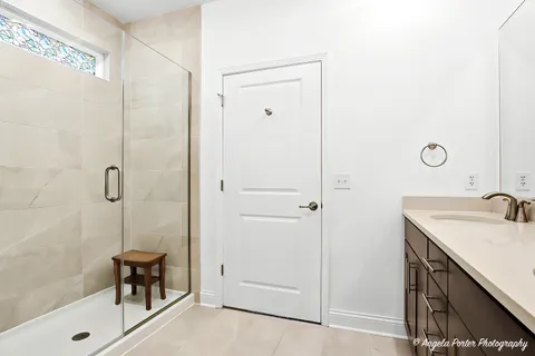 a bathroom with a sink and a shower