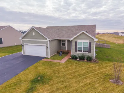 a view of a yard in front of a house with a yard