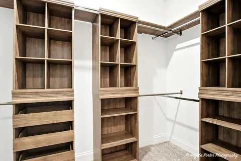 a view of an empty walk in closet