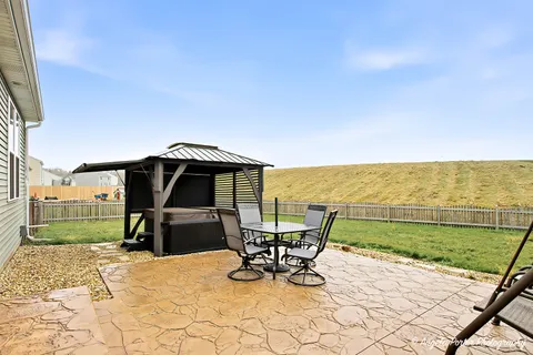 a view of a terrace with chairs and wooden floor