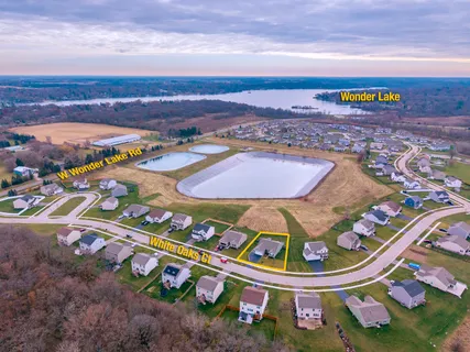an aerial view of residential houses with outdoor space