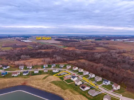 an aerial view of residential building and ocean view