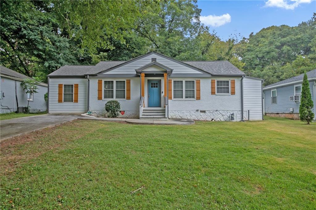 1945 Meadow Lane Decatur, GA 30032 - Photo 1 of 1 a front view of a house with a garden