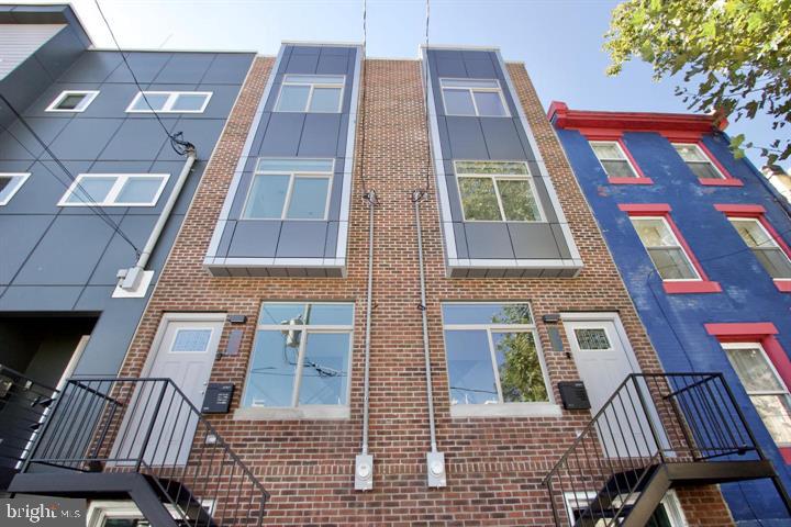 a front view of a multi story residential apartment building