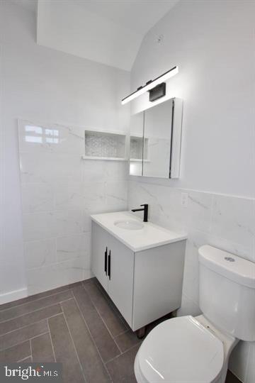 1608 North 3rd Street Philadelphia, PA 19122 - Photo 12 of 28 a bathroom with a sink a toilet and mirror