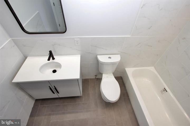 1608 North 3rd Street Philadelphia, PA 19122 - Photo 8 of 28 a bathroom with a sink and a mirror