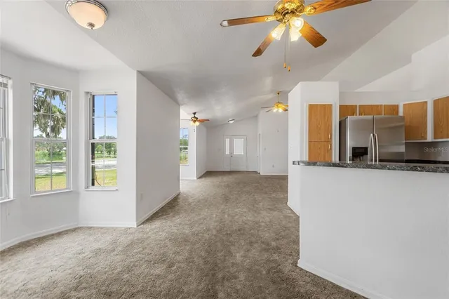 a view of a kitchen and a window