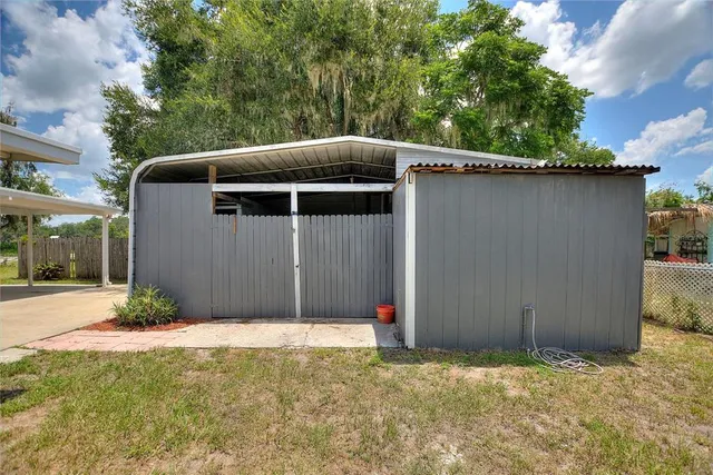 a house view with swimming pool in front of it