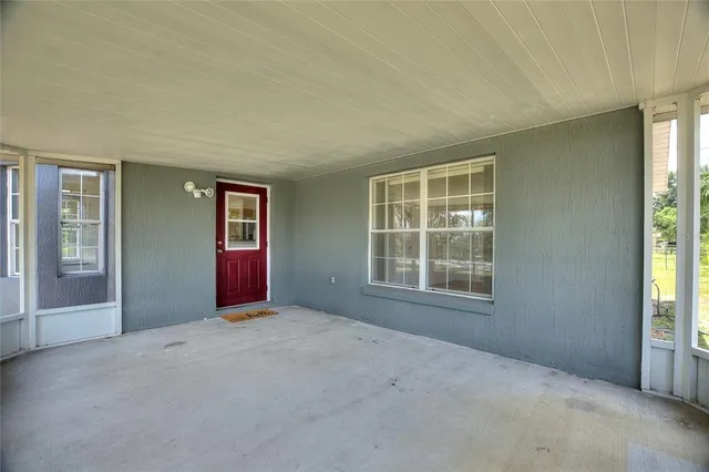 a house view with swimming pool in front of it