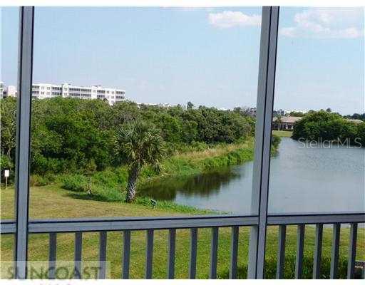 6499 99th Way North, Unit 18E Seminole, FL 33708 - Photo 1 of 1 Exterior Front - View from the spacious lanai.