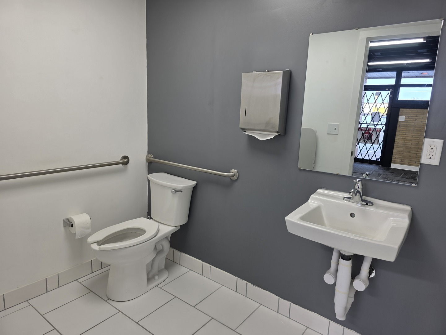 121 South State Street Belvidere, IL 61008 - Photo 37 of 43 a bathroom with a toilet a sink and mirror