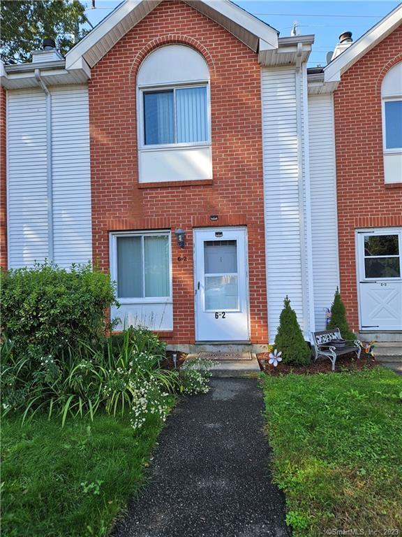 585 Park Road, Unit 62 Waterbury, CT 06708 - Photo 1 of 1 a front view of a house with garden