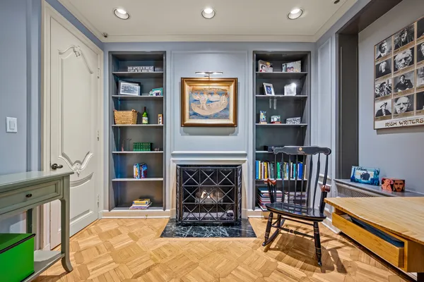 a kitchen with stainless steel appliances granite countertop a stove top oven a sink dishwasher a dining table and chairs with wooden floor