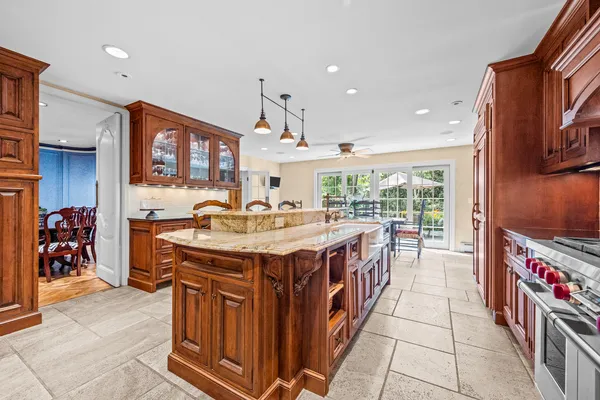 a view of a dining room with furniture chandelier and wooden floor
