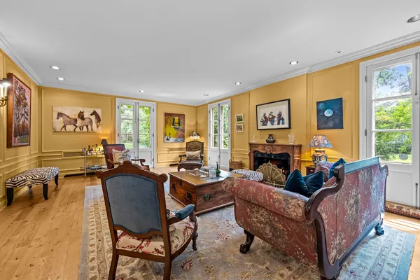 a living room with furniture and a rug