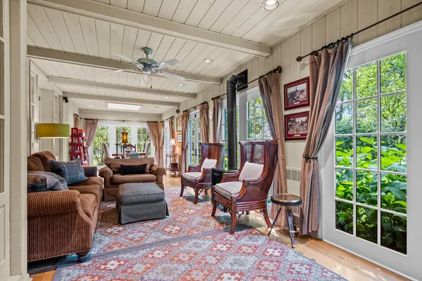 a dining room with furniture window wooden floor and front door