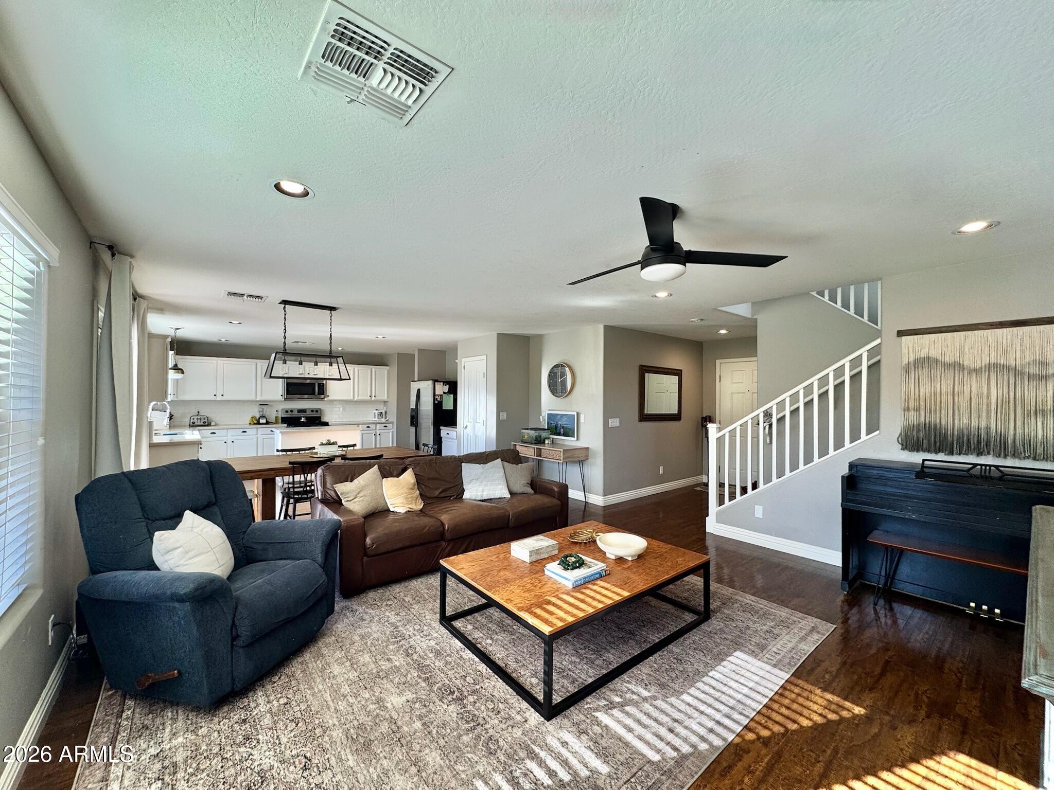 a living room with furniture and a table