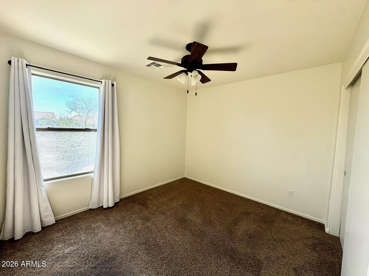 3555 East Michelle Way Gilbert, AZ 85234 - Photo 11 of 18 a view of room with a ceiling fan