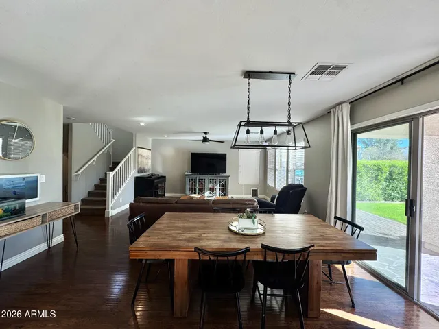 a view of a dining room with furniture window and wooden floor