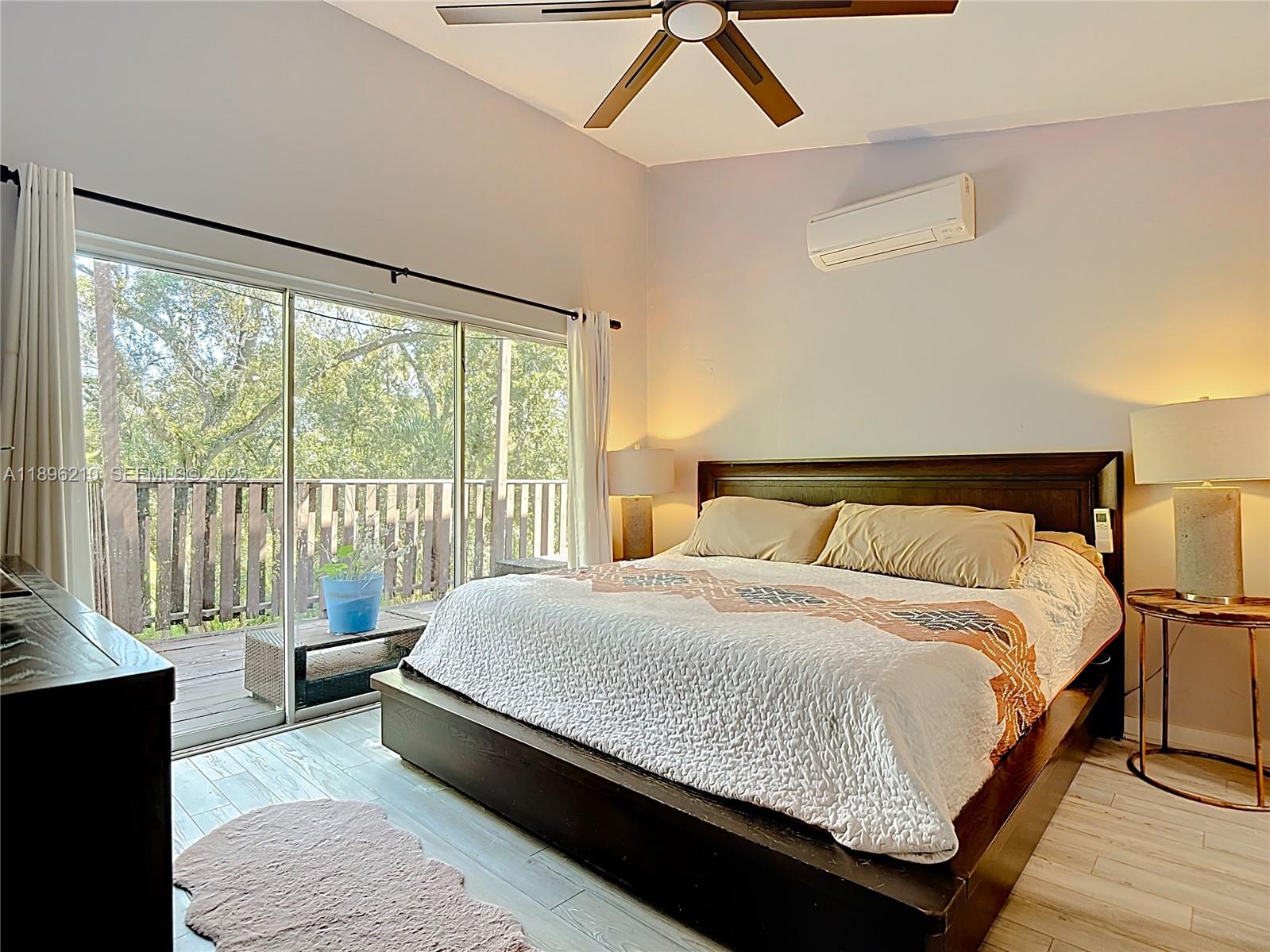 1270 Tom Coker Road LaBelle, FL 33935 - Photo 18 of 46 a large bedroom with a bed and a large window