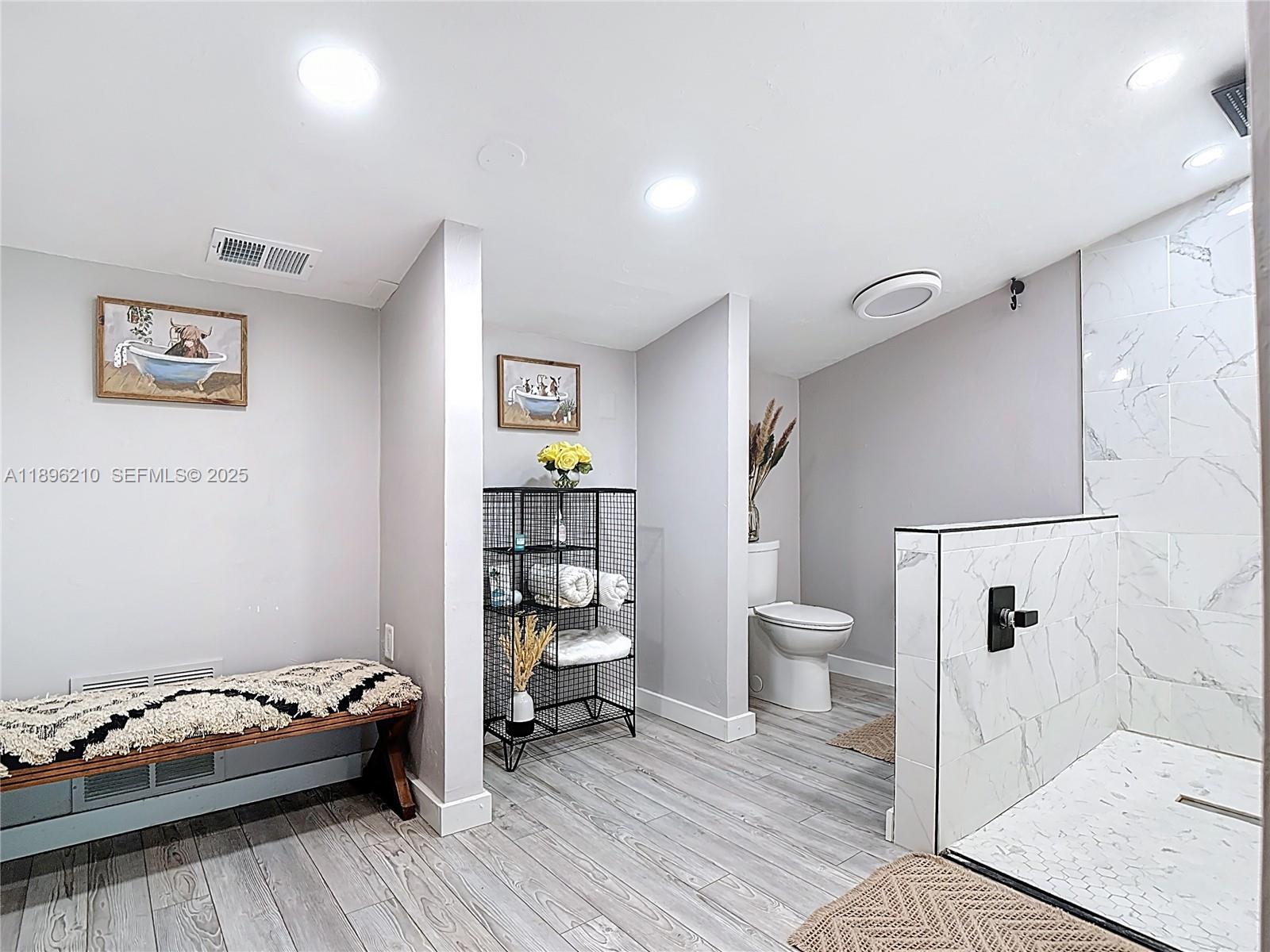 1270 Tom Coker Road LaBelle, FL 33935 - Photo 19 of 46 a bathroom with a toilet and a shower