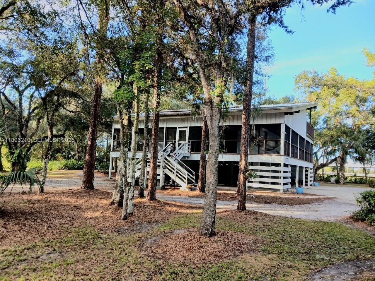 1270 Tom Coker Road LaBelle, FL 33935 - Photo 2 of 46 a view of outdoor space yard and porch