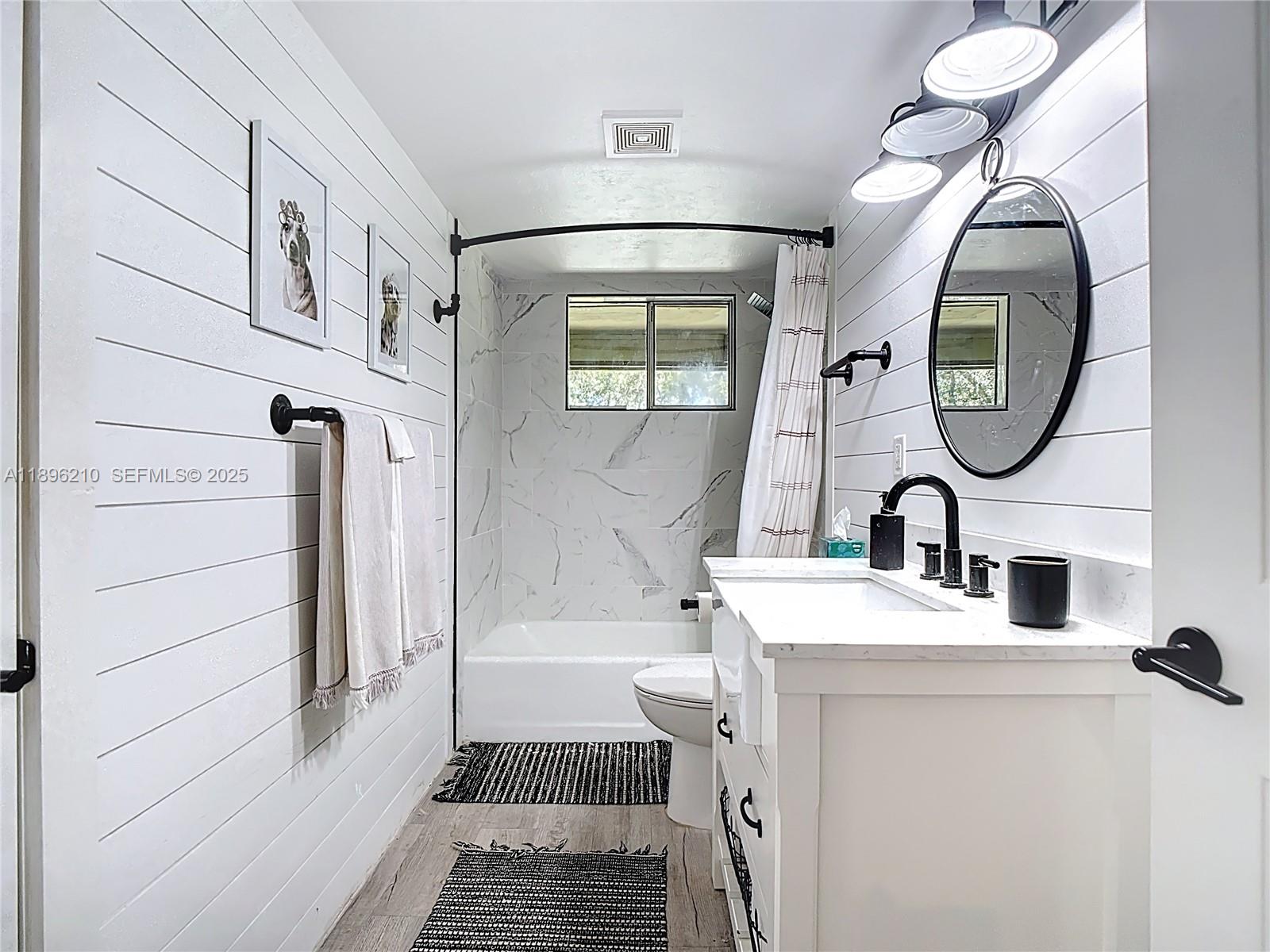 1270 Tom Coker Road LaBelle, FL 33935 - Photo 22 of 46 a bathroom with a sink and a mirror