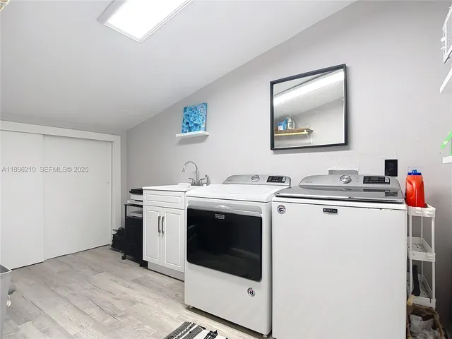 a utility room with dryer and washer