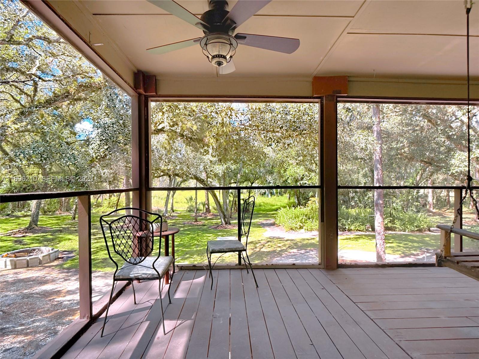 1270 Tom Coker Road LaBelle, FL 33935 - Photo 25 of 46 a view of a porch with wooden floor and outdoor space