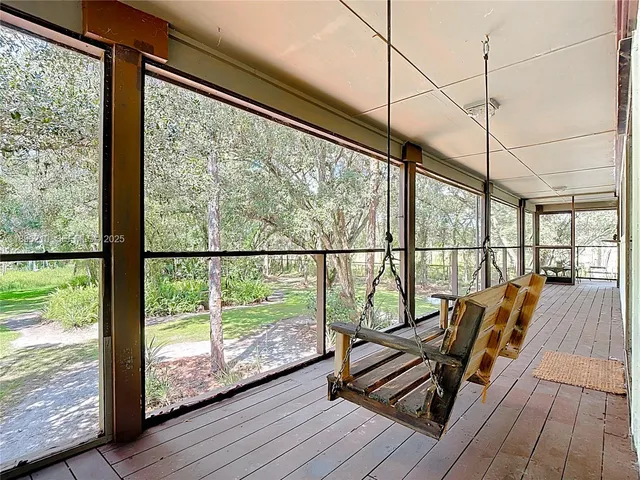 a view of a balcony with wooden floor